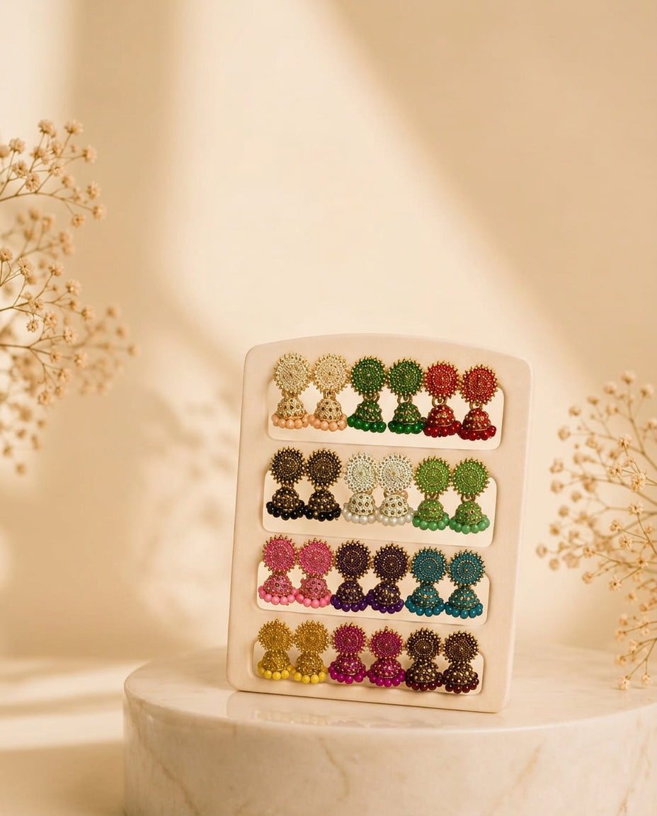 Beaded jhumka combo display board on marble pedestal